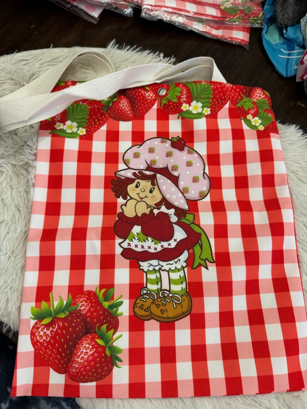 Strawberry Shortcake canvas tote bag with red and white checkered background